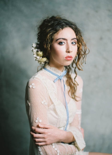 Young female model with blue eyes looking at camera.